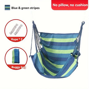 Tortola blue striped cotton blend hammock chair with wooden bar and ropes in a garden