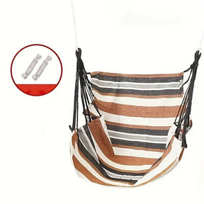 Tortola brown striped cotton blend hammock chair with wooden bar and ropes on a patio