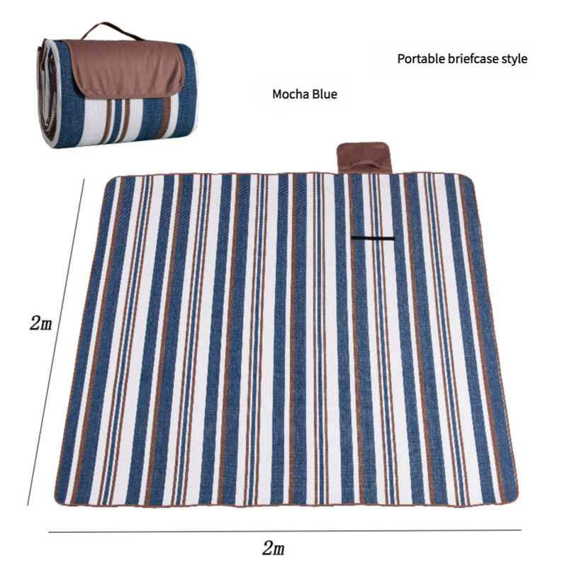 Hawkshead picnic blanket 200 x 200cm in mocha blue print laid on grass with soft fabric top and water resistant PEVA backing