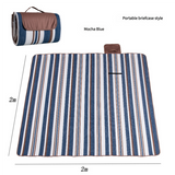 Hawkshead picnic blanket 200 x 200cm in mocha blue print laid on grass with soft fabric top and water resistant PEVA backing