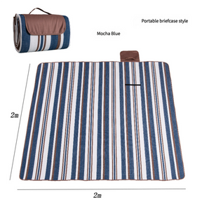 Hawkshead picnic blanket 200 x 200cm in mocha blue print laid on grass with soft fabric top and water resistant PEVA backing