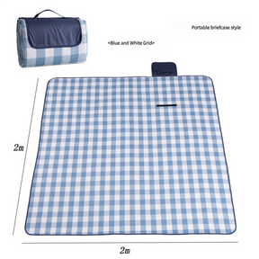 Hawkshead picnic blanket 200 x 200cm in blue and white checkered print laid on grass with soft fabric top and water resistant PEVA backing