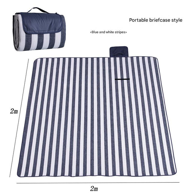 Hawkshead picnic blanket 200 x 200cm in blue and white stripe print laid on grass with soft fabric top and water resistant PEVA backing