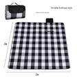 Hawkshead picnic blanket 200 x 200cm in black and white grid print laid on grass with soft fabric top and water resistant PEVA backing