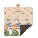 Hawkshead picnic blanket 200 x 200cm in little frog print laid on grass with soft fabric top and water resistant PEVA backing