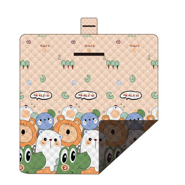 Hawkshead picnic blanket 200 x 200cm in little frog print laid on grass with soft fabric top and water resistant PEVA backing