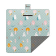 Hawkshead picnic blanket 200 x 200cm in green mood print laid on grass with soft fabric top and water resistant PEVA backing