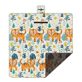 Hawkshead picnic blanket 200 x 200cm in king of the forest print laid on grass with soft fabric top and water resistant PEVA backing