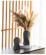 Narni Scalo twisted ceramic vase with a spiralling matte form