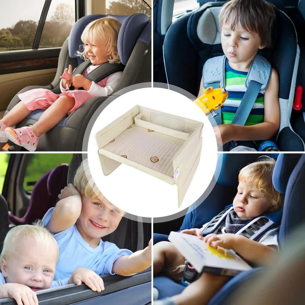 Child using car seat travel tray for drawing