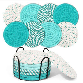 Cheshunt beige and blue woven cotton coasters set of eight with metal holder on a table