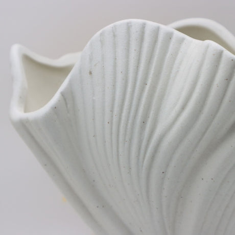 White sculptural ceramic vase with wide fluted opening