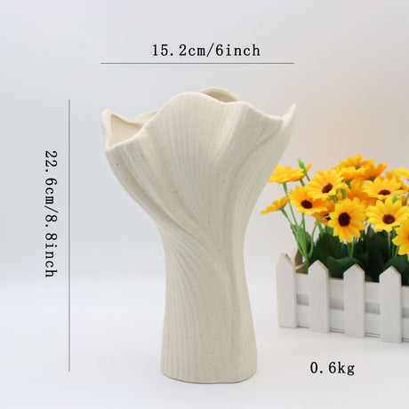 Beige sculptural ceramic vase with wide fluted opening