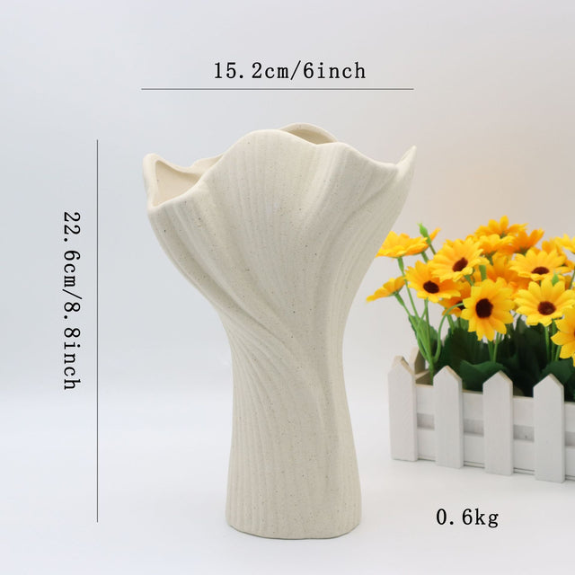 Beige sculptural ceramic vase with wide fluted opening