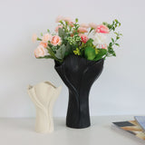 Beige sculptural ceramic vase with wide fluted opening