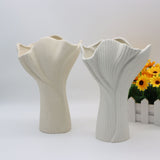 Beige sculptural ceramic vase with wide fluted opening