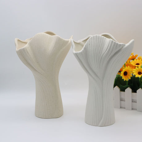 Beige sculptural ceramic vase with wide fluted opening