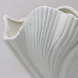 Black sculptural ceramic vase with wide fluted opening