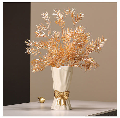 Cream ceramic vase with golden bow