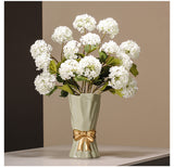 Cream ceramic vase with golden bow