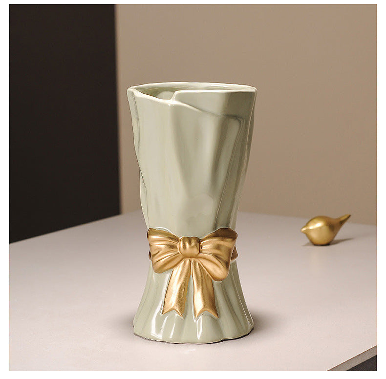 Cream ceramic vase with golden bow