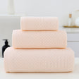 Three piece light pink waffle weave cotton towel set with bath towel, hand towel and face cloth
