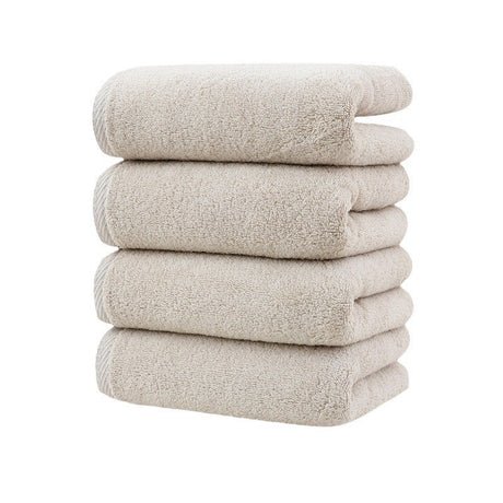 Four pack of khaki cotton hand towels, 34 by 78 cm, folded in a stack