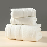 White cotton terry three piece towel set with bath towel, hand towel and face washer