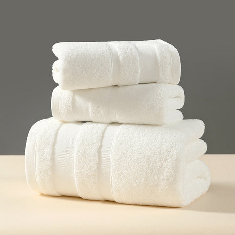 White cotton terry three piece towel set with bath towel, hand towel and face washer