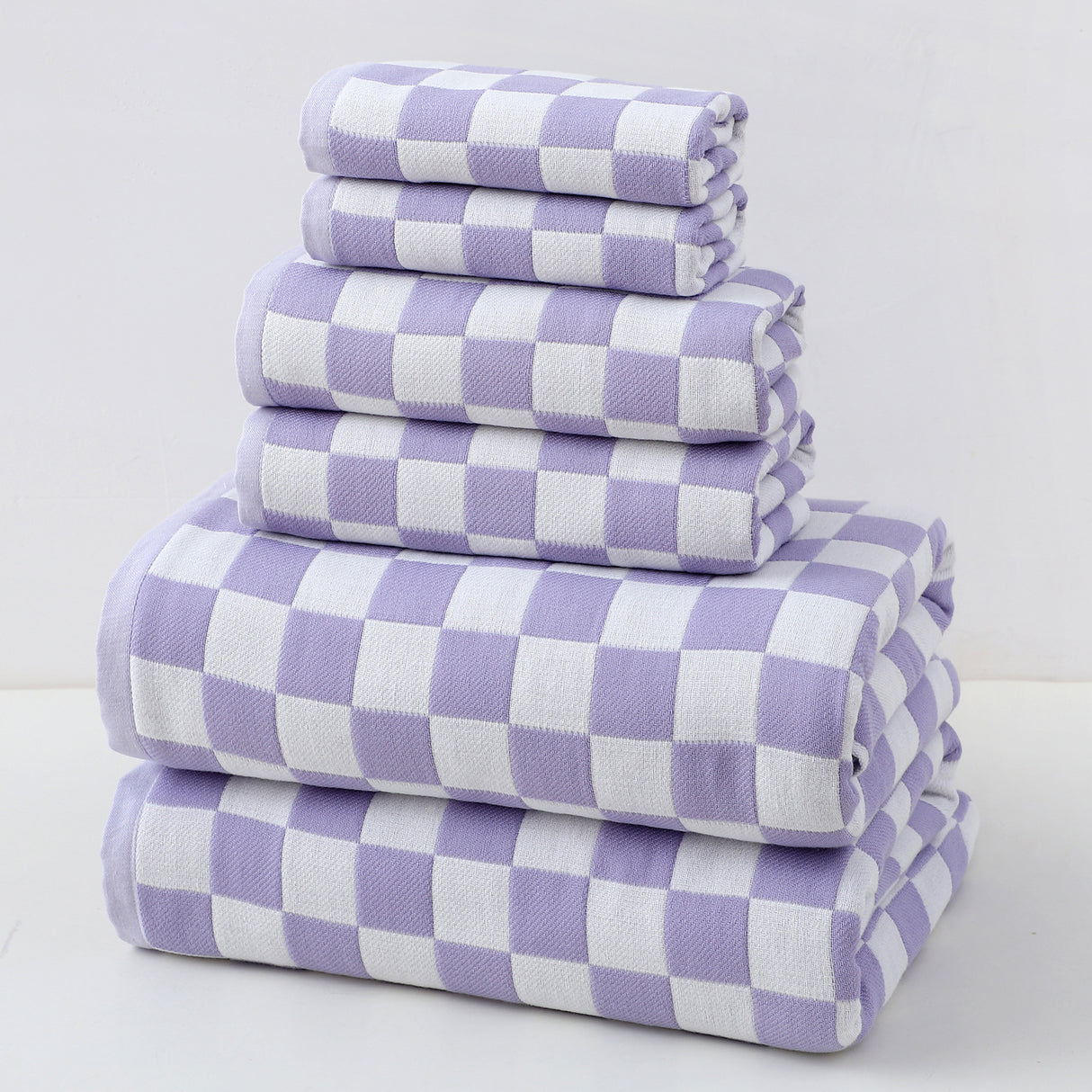 Purple cotton gauze six piece towel set with bath towels, hand towels and face washers folded together
