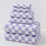 Purple cotton gauze six piece towel set with bath towels, hand towels and face washers folded together