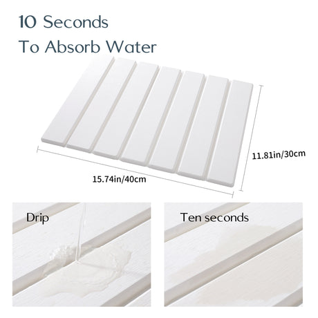 Light grey drain mat folded in half to show its compact storage size