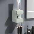 Green wall mounted automatic toothpaste dispenser with UV steriliser and toothbrush holder