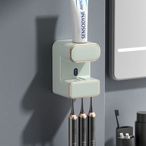 Green wall mounted automatic toothpaste dispenser with UV steriliser and toothbrush holder