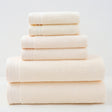 Beige combed cotton towel set with bath towel, hand towel and face washer