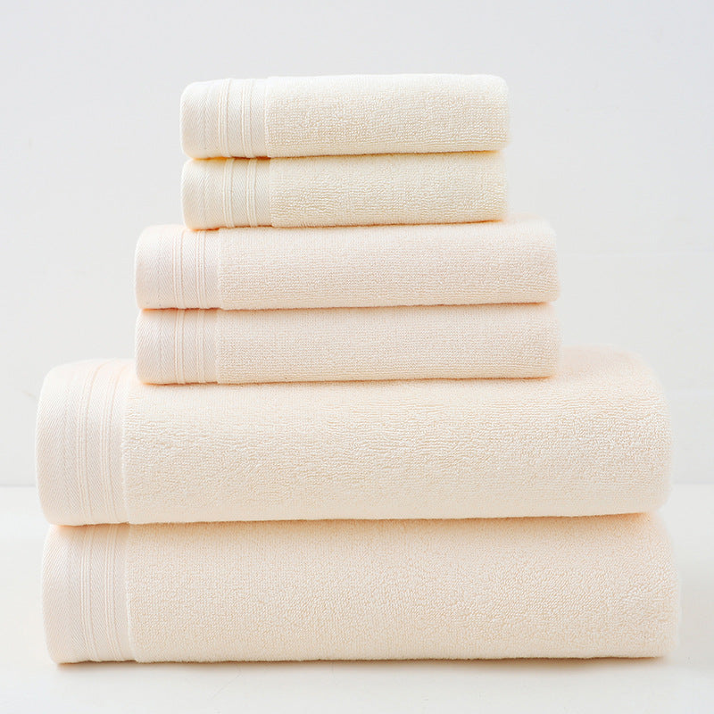 Beige combed cotton towel set with bath towel, hand towel and face washer