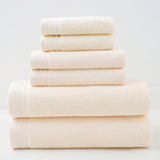 Beige combed cotton towel set with bath towel, hand towel and face washer