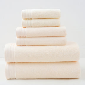 Beige combed cotton towel set with bath towel, hand towel and face washer