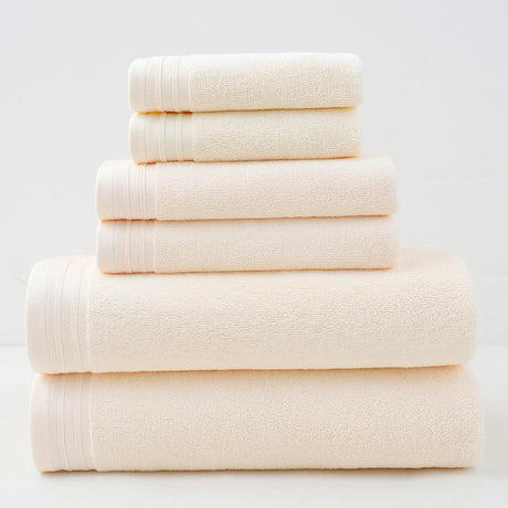 Beige combed cotton towel set with bath towel, hand towel and face washer