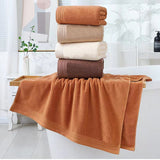 Close up of camel combed cotton towel pile and woven border detail