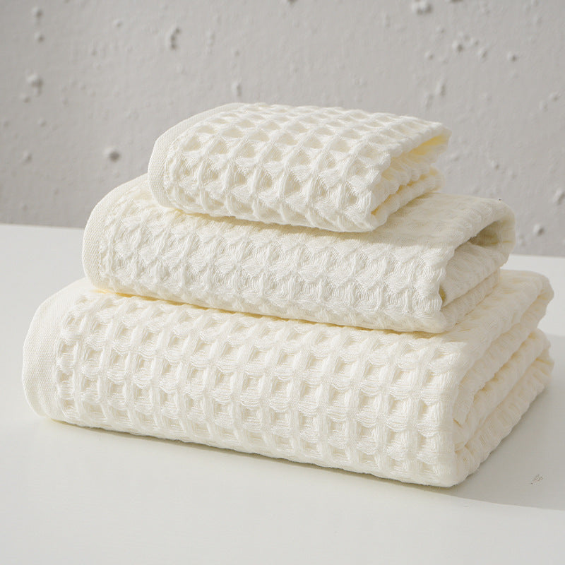 Three piece white waffle weave cotton towel set with bath towel, hand towel and washcloth