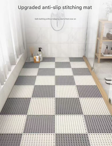 White and grey interlocking PVC floor tiles laid across a shower floor