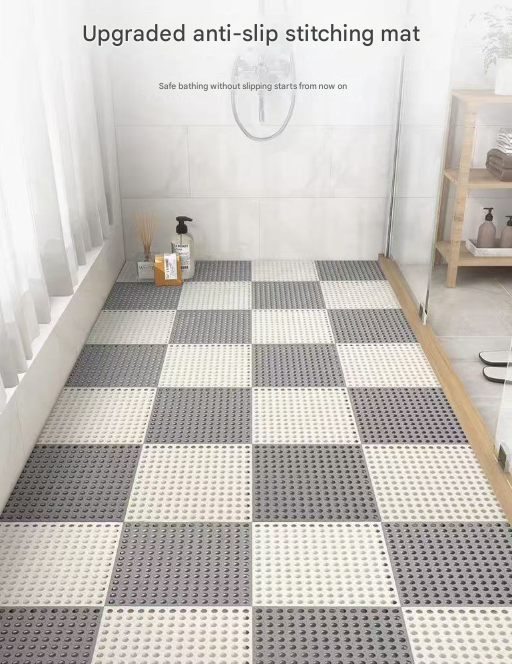 Green and pink interlocking PVC non slip floor tiles arranged in a grid