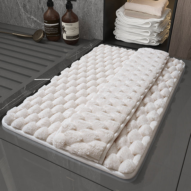 Checkered beige memory foam bath mat with integrated foot drying panel