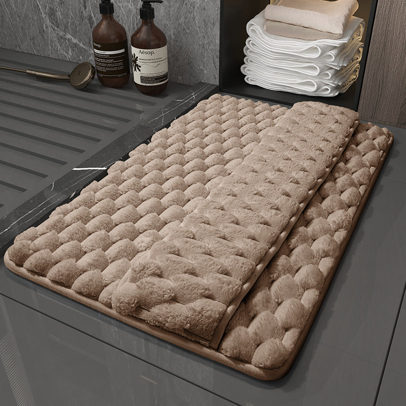 Checkered brown memory foam bath mat with integrated foot drying panel