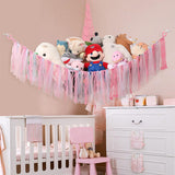 Corner plush toy storage hammock with pink ribbon accent