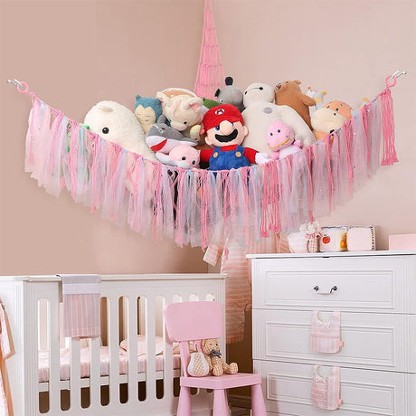 Corner plush toy storage hammock with pink ribbon accent