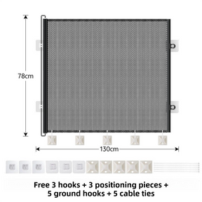 Black retractable mesh safety gate extended across a wide doorway