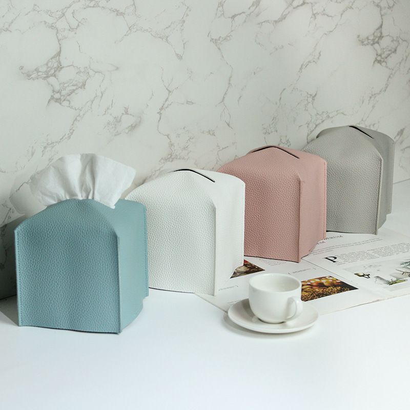 Brown tissue box cover with paper feeding through the top opening