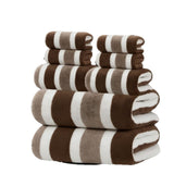 Eight piece brown coral fleece towel set with bath sheets, towels and face cloths in a wide stripe texture